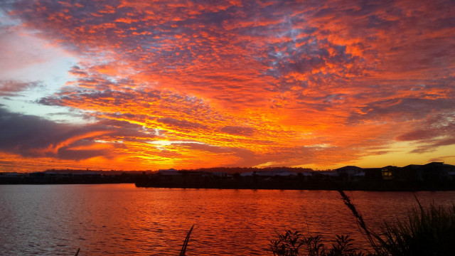 Sunset water clouds building horizon free wallpaper - medium preview image