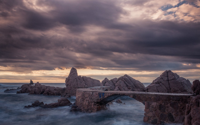 Bridge water rocks cloudy sky free wallpaper - medium preview image