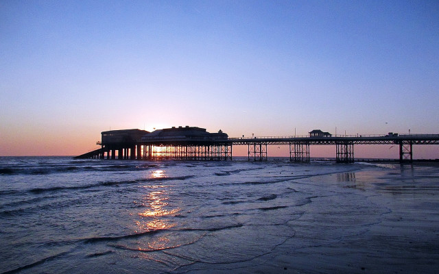 Pier sunset reflection cityscape clouds free wallpaper - medium preview image