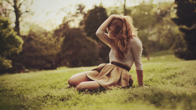 Woman sitting grass hands head free wallpaper for desktop - medium preview image