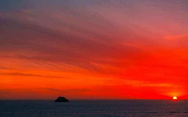 Sunset ocean island clouds mountain free wallpaper - medium preview image