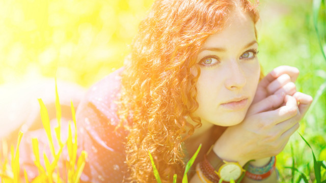 Woman grass serious face portrait free wallpaper for desktop - medium preview image
