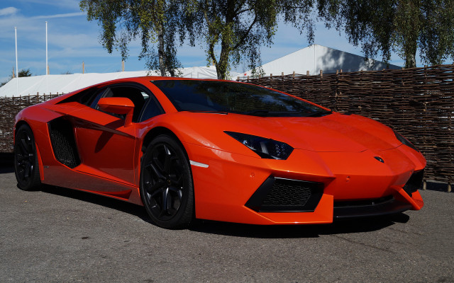 Bright orange sports car parking #12 free wallpaper - medium preview image
