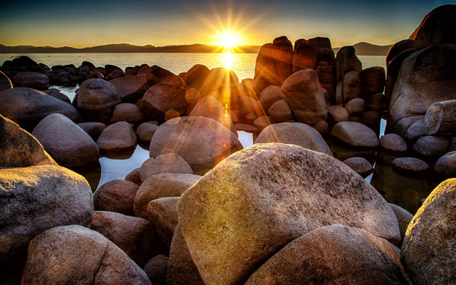 Sunset water rocks lens flare free wallpaper - medium preview image