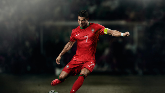 Man red uniform kicking soccer #2 free wallpaper - medium preview image