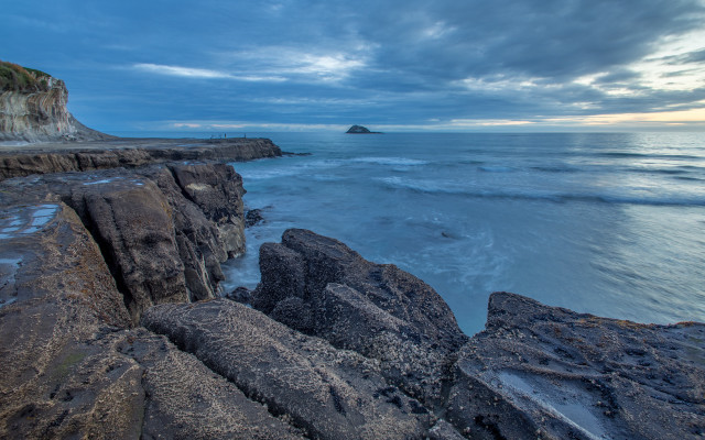 Rocky cliff water outcropping beach #2 free wallpaper - medium preview image