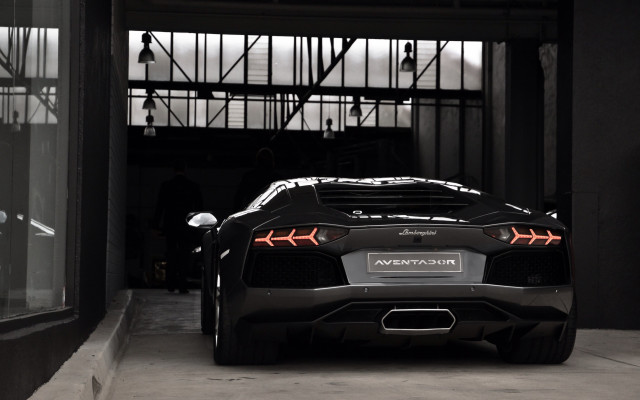 Black sports car garage man #2 free wallpaper - medium preview image