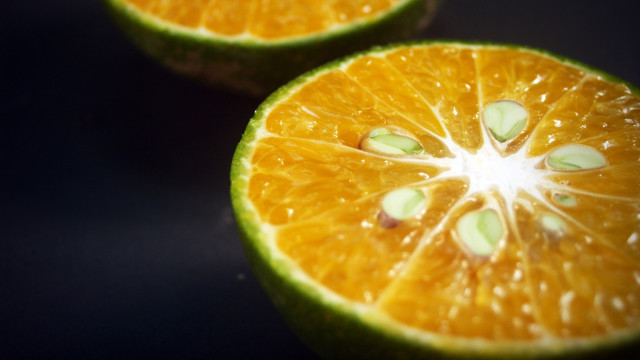 Orange halves seeds macro photorealism free wallpaper - medium preview image