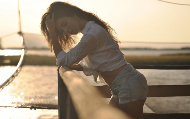 Woman beach driftwood sunset denim free wallpaper for desktop - medium preview image