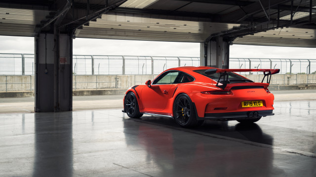 Red sports car surfboard parking free wallpaper - medium preview image