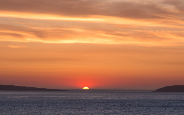Sunset water boat hill trees free wallpaper - medium preview image