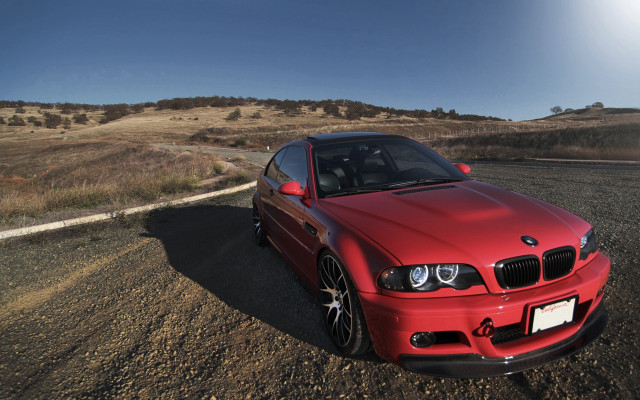 Red car road field hills free wallpaper - medium preview image