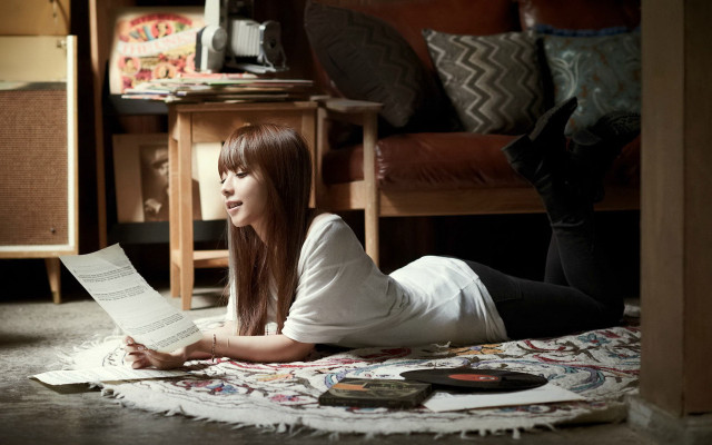 Woman lying reading book brown free wallpaper - medium preview image