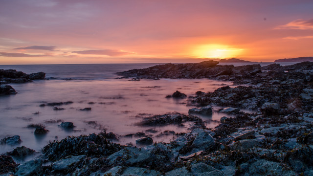 Sunset rocky beach water cityscape #2 free wallpaper - medium preview image