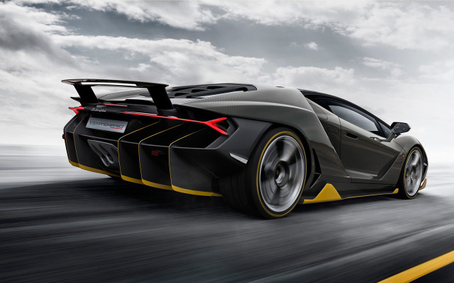 Black yellow sportscar driving clouds free wallpaper - medium preview image