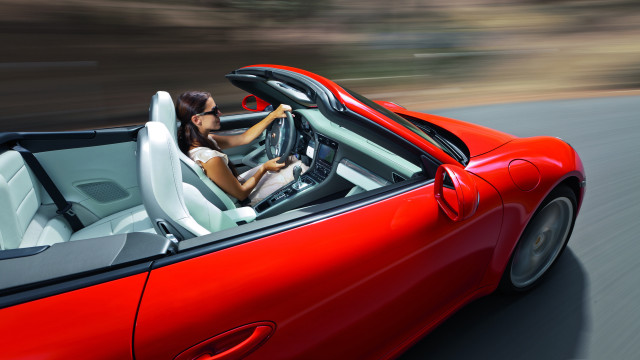 Woman driving red sports car free wallpaper - medium preview image