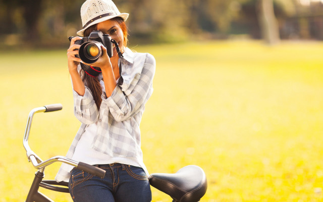 Woman biking self portrait field free wallpaper - medium preview image