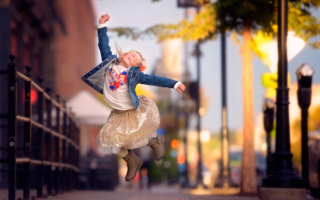 Girl jumping autumn blurry bokeh free wallpaper - medium preview image