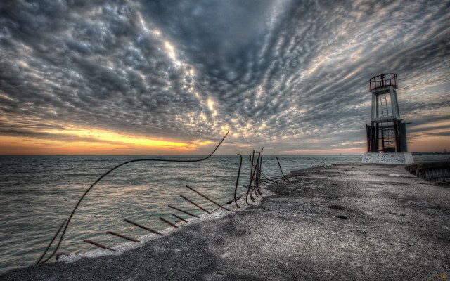 Lighthouse pier sunset clouds cityscape free wallpaper - medium preview image