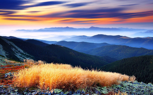 Mountain grassy field sunset clouds free wallpaper - medium preview image