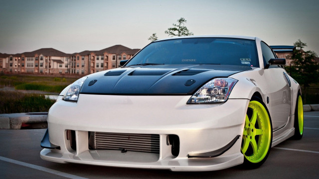 White car yellow rims parking free wallpaper - medium preview image