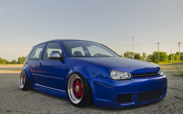 Blue car parking lot grass free wallpaper - medium preview image