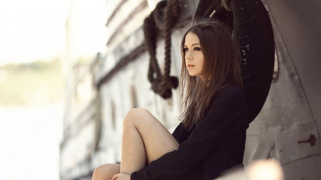 Woman sitting wall clock outdoor free wallpaper - medium preview image