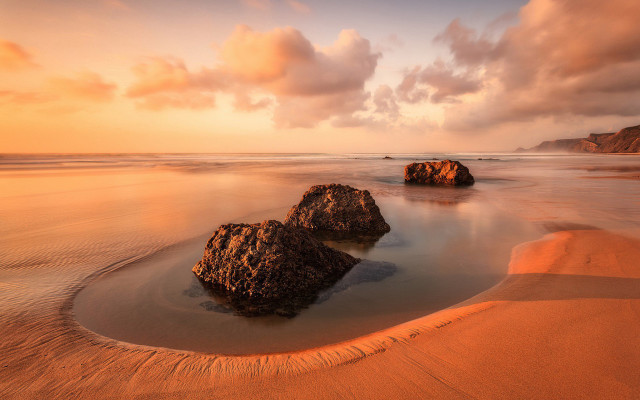 Sunset beach rocks water clouds free wallpaper - medium preview image
