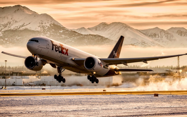 Plane takeoff mountains fog backlit free wallpaper - medium preview image