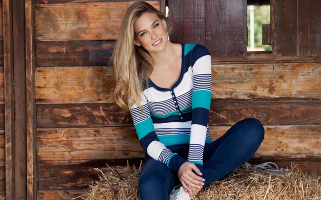 Woman hay pile smile brick free wallpaper - medium preview image
