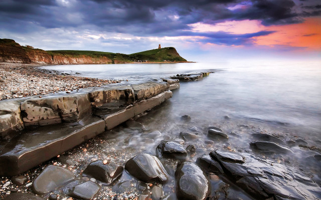 Rocky beach lighthouse cloudy sunset free wallpaper - medium preview image