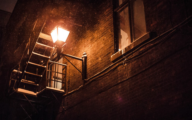 Streetlight brickbuilding stairway window night free wallpaper - medium preview image