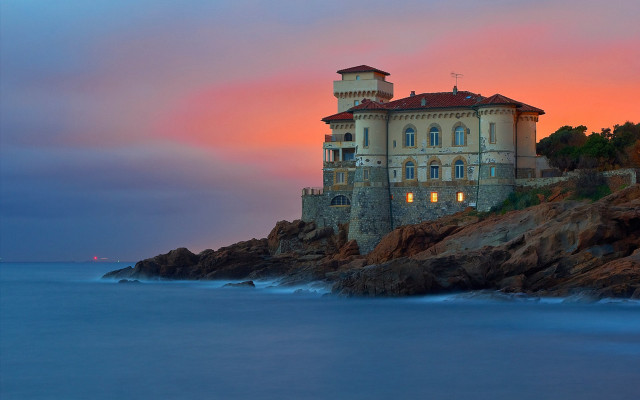 Cliffside mystical building sunset ocean free wallpaper - medium preview image