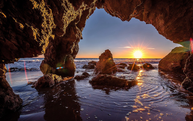 Sunset ocean cave beach rocks free wallpaper - medium preview image