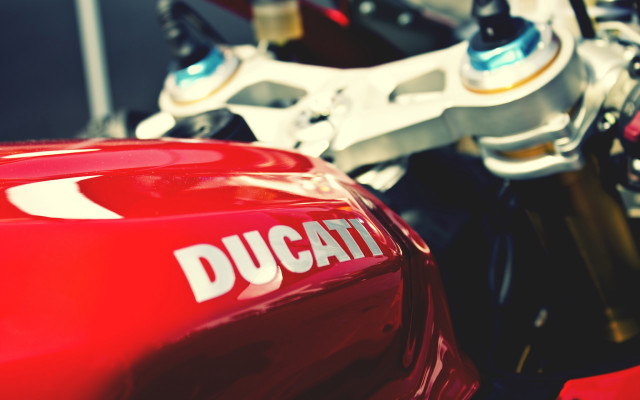 Red motorcycle ducati closeup blurry free wallpaper - medium preview image