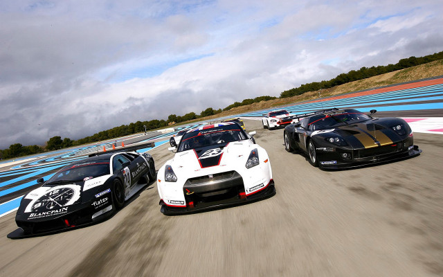 Racing cars tiltshift cloudy day free wallpaper - medium preview image
