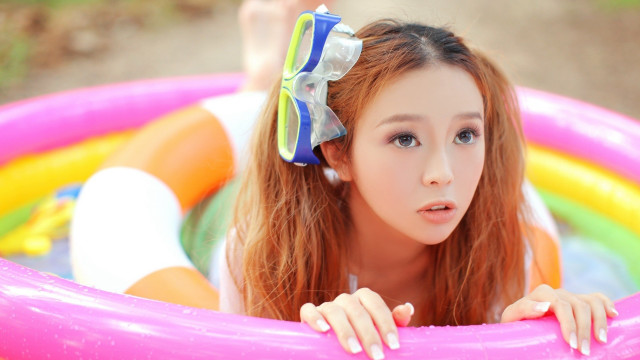 Woman bow pool inflatable portrait free wallpaper - medium preview image