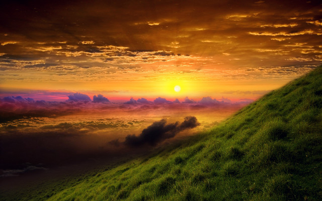 Grassy hill sunset clouds cityscape free wallpaper - medium preview image