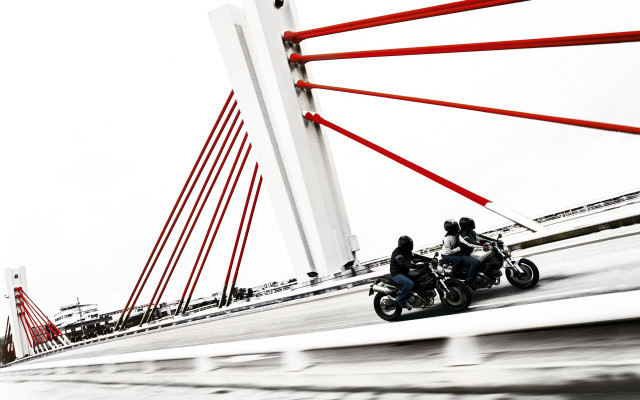 Motorcycles bridge water red poles free wallpaper - medium preview image