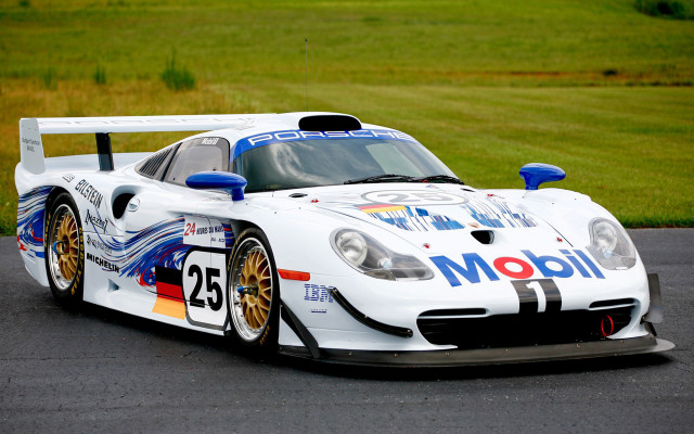White racecar driving racetrack grass free wallpaper - medium preview image