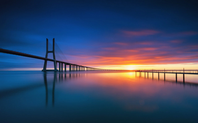 Sunset bridge water sky mountains free wallpaper - medium preview image
