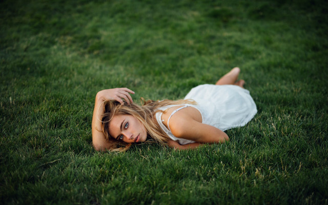 Woman white dress laying grass free wallpaper - medium preview image
