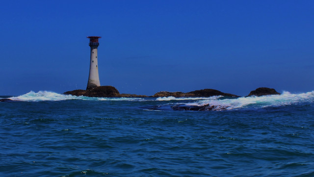 Lighthouse rocky island ocean waves free wallpaper - medium preview image