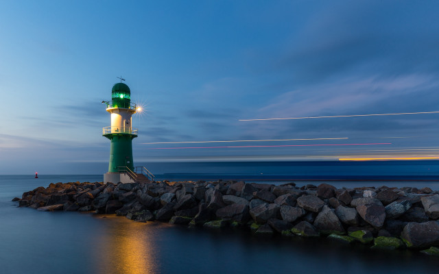 Lighthouse rocky shore night longexposure free wallpaper - medium preview image