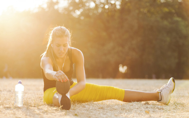 Woman yellow skirt exercising beach free wallpaper - medium preview image