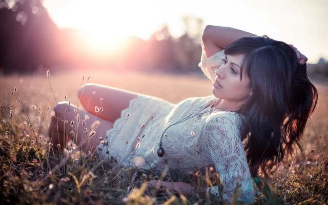 Woman grass field blowing hair free wallpaper - medium preview image