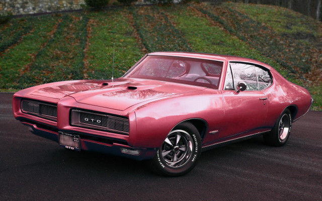 Red car street hill green free wallpaper - medium preview image