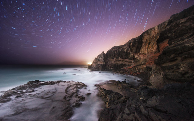 Rocky cliff starry sky beach free wallpaper - medium preview image