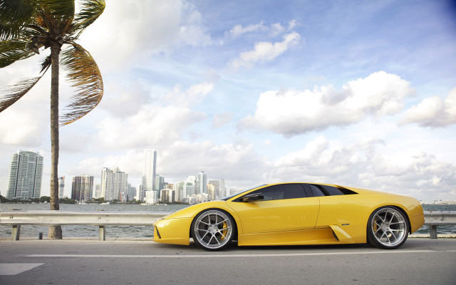 Yellow sports car city skyline free wallpaper - medium preview image