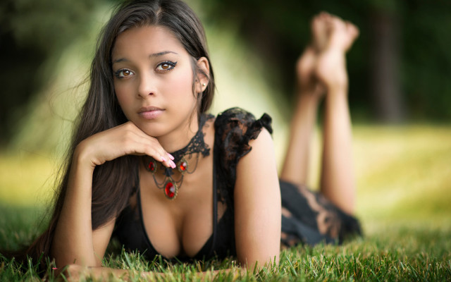 Woman lying grass hands chest free wallpaper - medium preview image